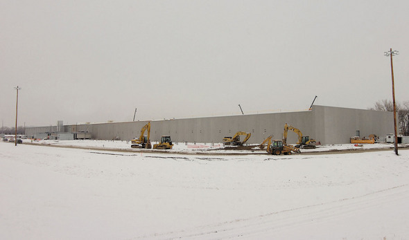 Construction temporarily halted by a December snowstorm.